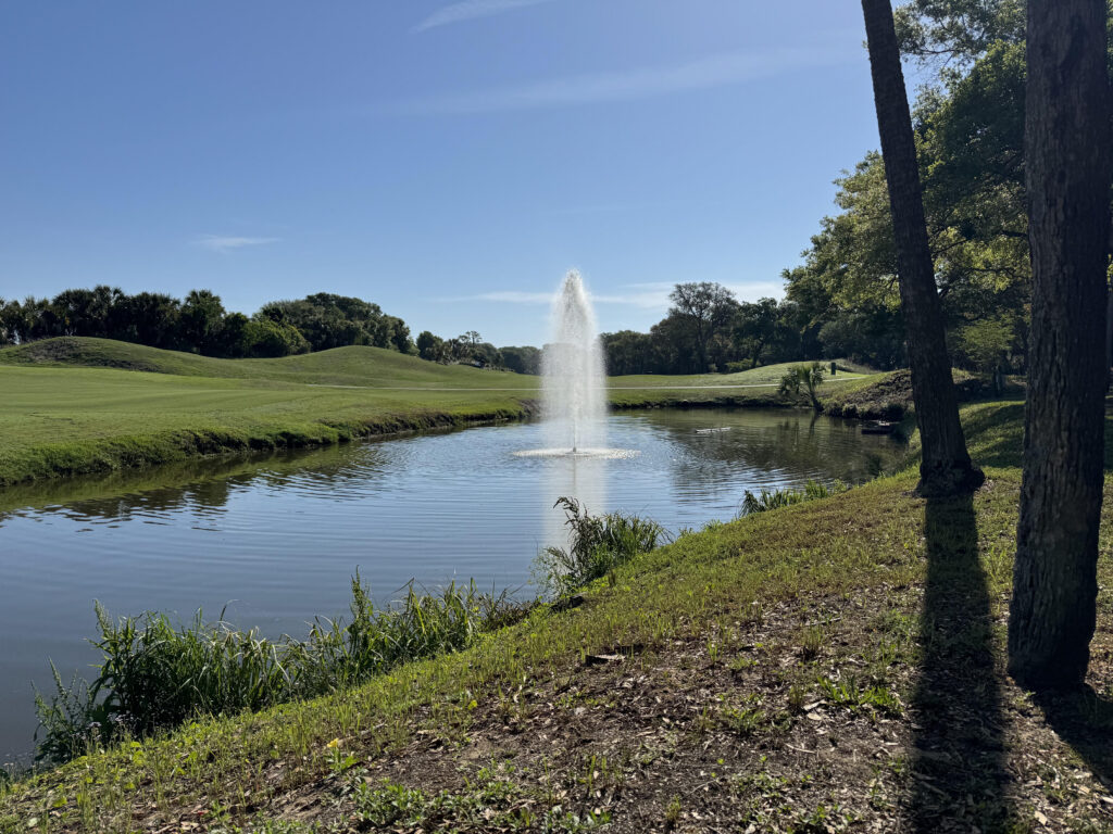 Tall fountain aerating a golf course pond